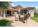 Outdoor living space with fire pit, stone patio, grill, and easy access to the home's interior at 6634 Window Rock Ln, Morrison, CO 80465