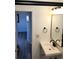 Bathroom featuring a modern sink vanity, mirror, and lighting at 609 S 1St Ave, Brighton, CO 80601
