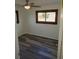 Bedroom featuring a large window, hardwood flooring and neutral wall paint at 609 S 1St Ave, Brighton, CO 80601