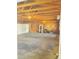 Large garage with storage shelves, an overhead door, and ample space for vehicles and projects at 609 S 1St Ave, Brighton, CO 80601