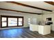 Open-concept kitchen and living room with modern cabinets and hardwood flooring at 609 S 1St Ave, Brighton, CO 80601