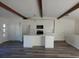 Bright kitchen featuring sleek countertops, white cabinets, and hardwood flooring at 609 S 1St Ave, Brighton, CO 80601