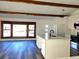 Open-concept kitchen featuring a large island with hardwood flooring at 609 S 1St Ave, Brighton, CO 80601