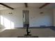 A kitchen island with hardwood flooring and exposed ceiling beams at 609 S 1St Ave, Brighton, CO 80601