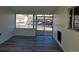 Living room featuring modern flooring, fireplace, and large windows offering plenty of natural light at 609 S 1St Ave, Brighton, CO 80601