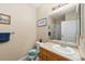 Well-maintained bathroom with a vanity, large mirror, and a walk-in shower for added convenience at 4084 S Crystal Cir # 104, Aurora, CO 80014