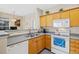 Efficient kitchen with a breakfast bar, essential appliances, and practical layout at 4084 S Crystal Cir # 104, Aurora, CO 80014