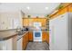 Functional kitchen with ample cabinet space and essential appliances at 4084 S Crystal Cir # 104, Aurora, CO 80014