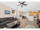 Open-concept living room that seamlessly connects to dining area and kitchen at 4084 S Crystal Cir # 104, Aurora, CO 80014