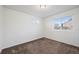 Clean bedroom featuring carpet and two windows letting in natural light at 10185 Xanadu St, Commerce City, CO 80022