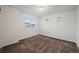 Neutral bedroom featuring carpet, and windows letting in natural light at 10185 Xanadu St, Commerce City, CO 80022