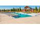 Beautiful community pool with a modern pergola, perfect for relaxation and recreation at 10185 Xanadu St, Commerce City, CO 80022