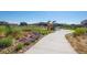 Landscaped walking path with colorful flowers, connecting the community with scenic views at 10185 Xanadu St, Commerce City, CO 80022