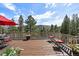 Spacious back deck offers seating and relaxing wooded views at 20410 Brookmont Rd, Morrison, CO 80465