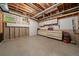 Unfinished basement with workshop area, storage cabinets, and visible ceiling pipes at 20410 Brookmont Rd, Morrison, CO 80465