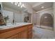 Bathroom featuring a vanity with modern fixtures and a shower-tub combo at 20410 Brookmont Rd, Morrison, CO 80465