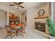 Cozy dining area with adjacent fireplace and view into the kitchen at 20410 Brookmont Rd, Morrison, CO 80465