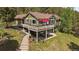 Beautiful two-story home with an inviting deck and lush landscaping at 20410 Brookmont Rd, Morrison, CO 80465