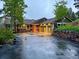 Charming home with a three-car garage, stone accents, and rock wall landscaping at 20410 Brookmont Rd, Morrison, CO 80465