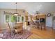 Kitchen and breakfast nook area with stainless steel appliances and hardwood floors at 20410 Brookmont Rd, Morrison, CO 80465