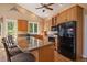 Spacious kitchen island with bar stool seating and stainless steel appliances at 20410 Brookmont Rd, Morrison, CO 80465