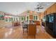 Spacious kitchen featuring an island with bar seating, stainless steel appliances, and hardwood floors at 20410 Brookmont Rd, Morrison, CO 80465