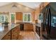 Kitchen with ample cabinet space, a large island and stainless steel appliances at 20410 Brookmont Rd, Morrison, CO 80465