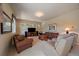 Inviting living room with neutral walls, plush seating, and entertainment center at 20410 Brookmont Rd, Morrison, CO 80465