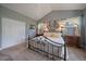 Comfortable main bedroom with plush carpet, decorative bed frame, and ample natural light at 20410 Brookmont Rd, Morrison, CO 80465