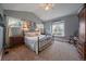 Spacious main bedroom featuring a cozy window seat and decorative iron bed frame at 20410 Brookmont Rd, Morrison, CO 80465