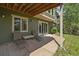 Outdoor patio with seating, views of the yard, and protection from above at 20410 Brookmont Rd, Morrison, CO 80465