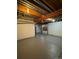 Unfinished basement with exposed pipes, concrete floor, and white painted walls at 1719 S Ensenada Way, Aurora, CO 80017