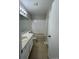 This is a well-lit bathroom with tile floors, large mirror, and vanity at 1719 S Ensenada Way, Aurora, CO 80017