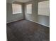 Bedroom featuring 3 windows, carpet flooring, and neutral colored walls at 1719 S Ensenada Way, Aurora, CO 80017