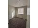 A bedroom with natural light from window, carpet flooring, and neutral paint at 1719 S Ensenada Way, Aurora, CO 80017