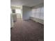 This bedroom features neutral walls, carpeting, and a large window for natural light at 1719 S Ensenada Way, Aurora, CO 80017