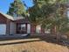 This charming two-story home includes a wheelchair ramp and mature trees at 1719 S Ensenada Way, Aurora, CO 80017
