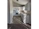The home has a kitchen with white cabinets, modern appliances, and vinyl floors at 1719 S Ensenada Way, Aurora, CO 80017