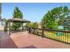 Well maintained back deck with dark metal railing and gazebo overlooking a grassy yard at 3525 Rinn Valley Dr, Longmont, CO 80504
