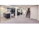 Finished basement area with carpeting, columns, wet bar and media area at 3525 Rinn Valley Dr, Longmont, CO 80504