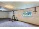 Unfinished basement with carpeting and a window at 3525 Rinn Valley Dr, Longmont, CO 80504