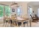 Well-lit dining area boasts large windows, neutral decor, and comfortable seating at 3525 Rinn Valley Dr, Longmont, CO 80504