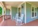 Relaxing front porch featuring rocking chairs and outdoor decor at 3525 Rinn Valley Dr, Longmont, CO 80504