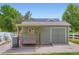 Well-maintained storage shed in backyard with adjacent fenced garden area at 3525 Rinn Valley Dr, Longmont, CO 80504