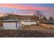 Rear exterior of the home showing a large backyard with mountain views at 214 Iowa Dr, Golden, CO 80403