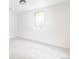 Basement bedroom with white walls and a window at 214 Iowa Dr, Golden, CO 80403