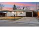 Cozy single-level home with a garage, well-kept lawn, and a welcoming entrance at 214 Iowa Dr, Golden, CO 80403