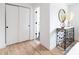 Hallway with modern decorations, closet with smooth sliding doors, and hardwood floors throughout the home at 214 Iowa Dr, Golden, CO 80403