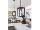 Kitchen island pendant lighting with view of dining and living area at 214 Iowa Dr, Golden, CO 80403