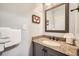 Bathroom with granite vanity and large mirror at 246 Broken Lance Dr # 503, Breckenridge, CO 80424